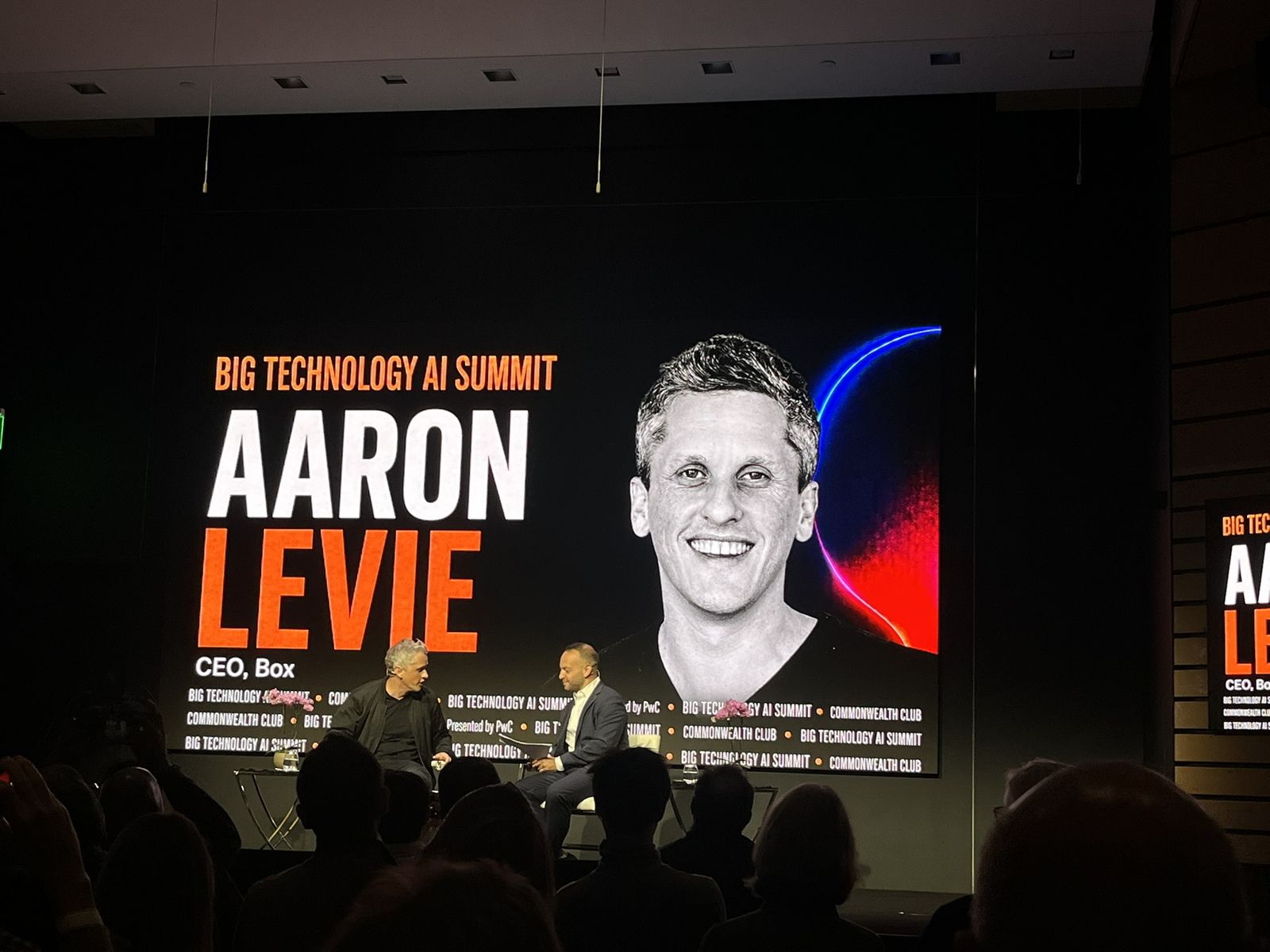 Aaron Levie of Box on the big screen during his on-stage interview