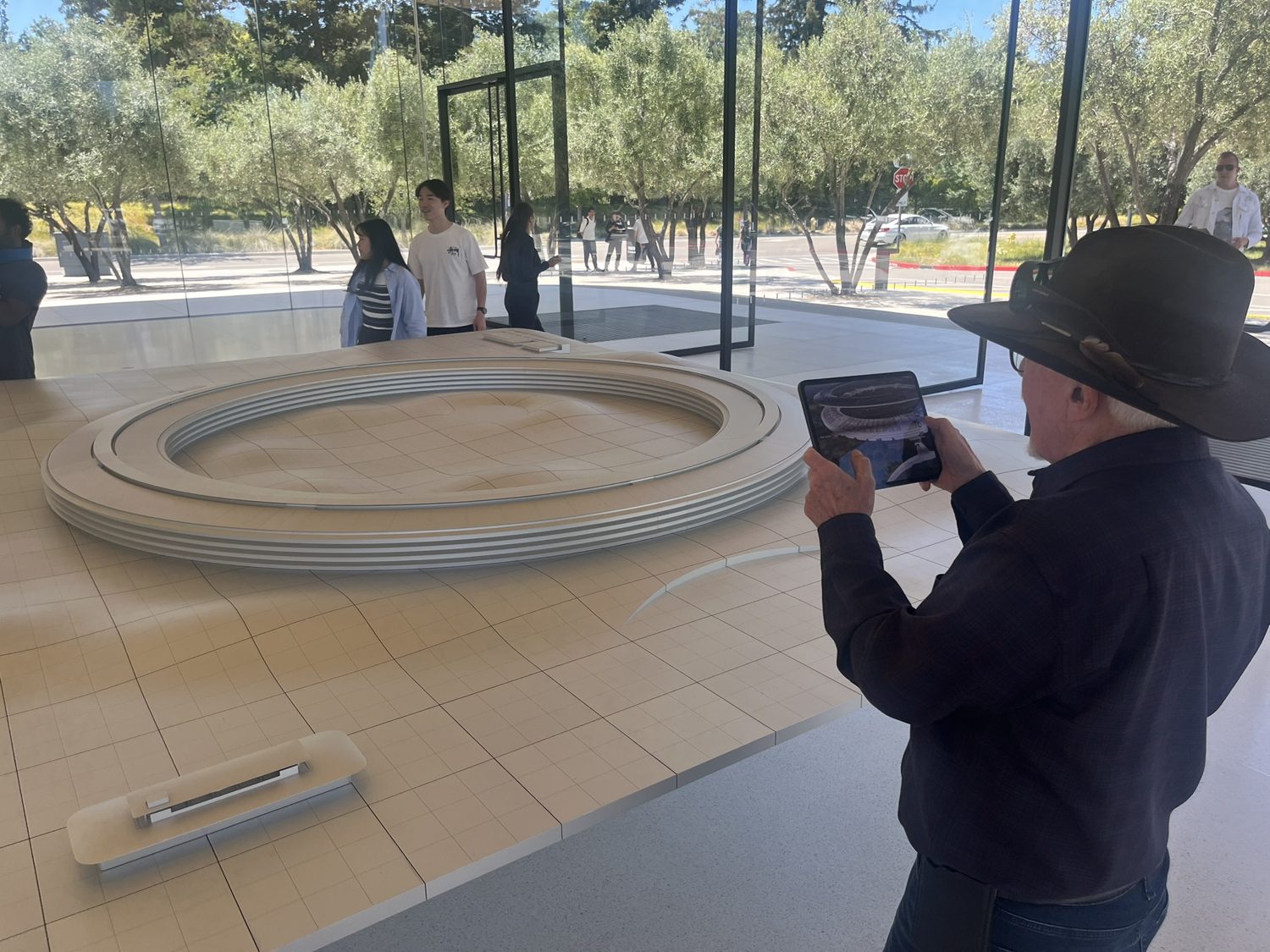 David photographing the Apple Park ring model at the visitor centre