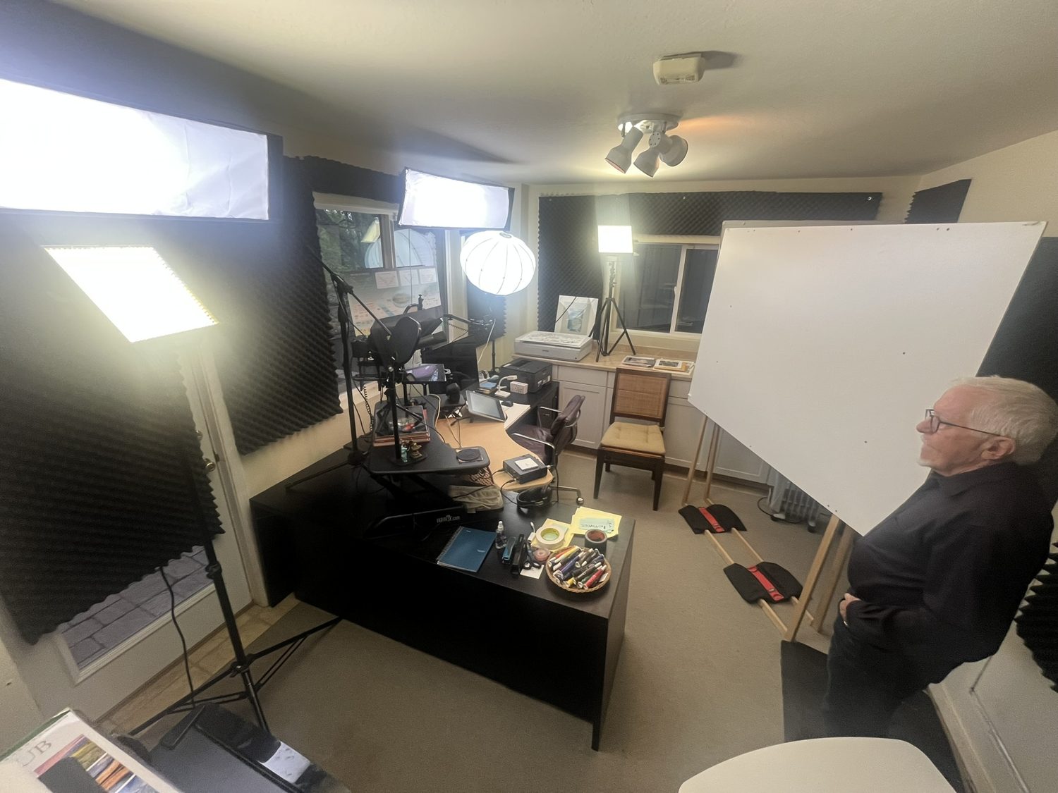 David Sibbet's studio with an easel, lights and a desk of markers