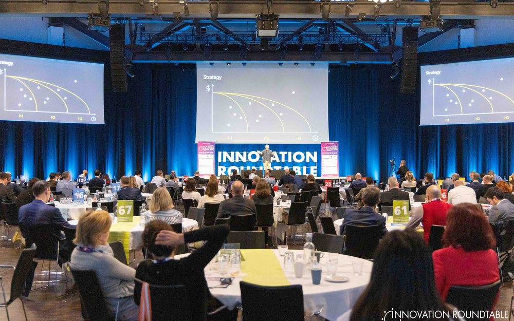 A facilitated session in a full conference room